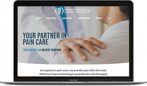 A Macbook showing the homepage of Comprehensive Pain & Neurology Center's website